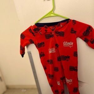 Red onesie footy pj with trucks on it